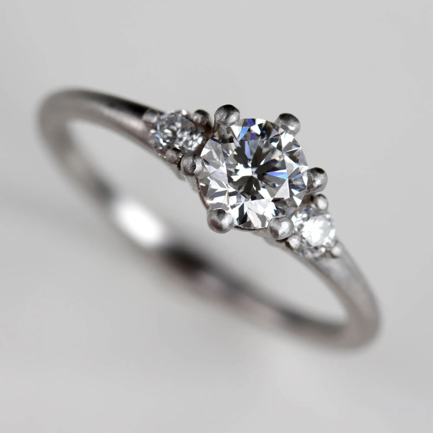 5mm Prong-set Three Stone Ring •