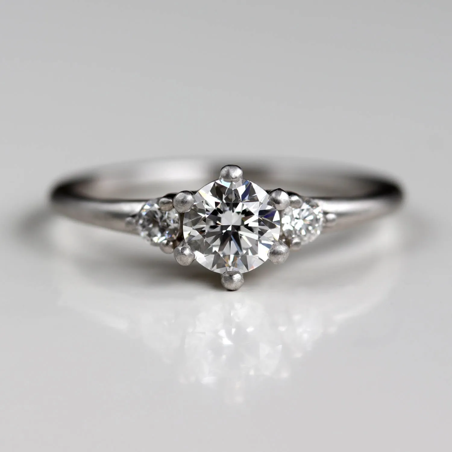 5mm Prong-set Three Stone Ring •