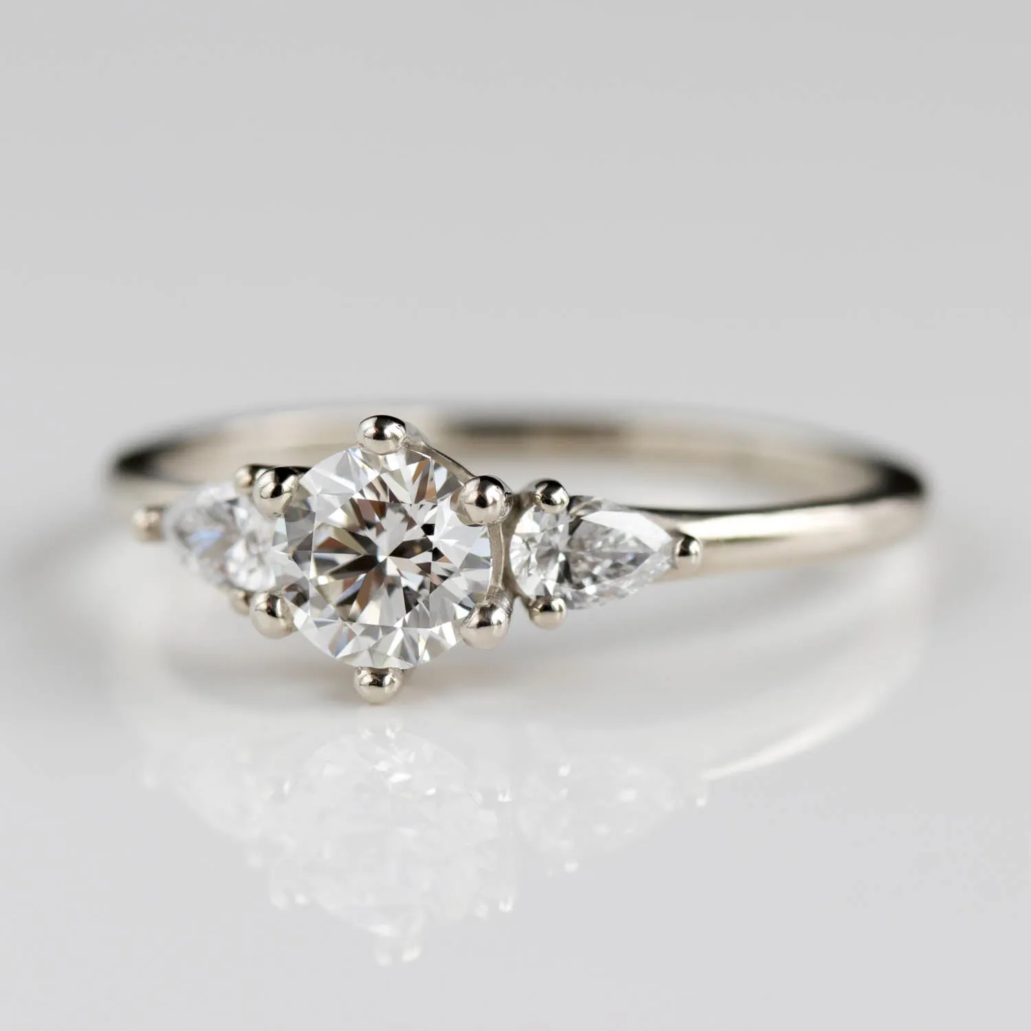 5mm Prong-set Three Stone Ring with Pear-Shaped Side Stones