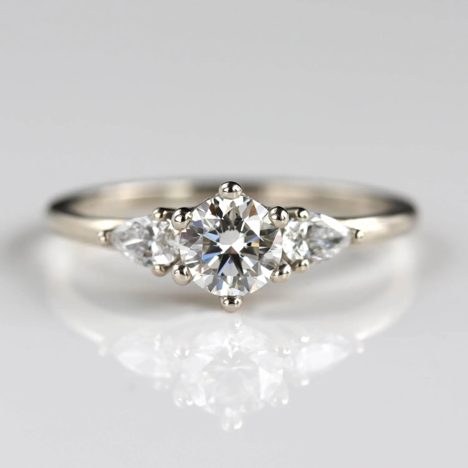 5mm Prong-set Three Stone Ring with Pear-Shaped Side Stones