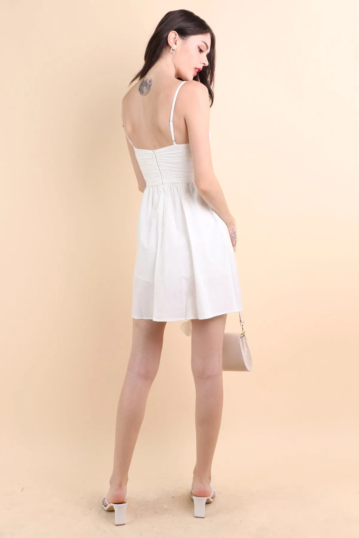 LOLA SLEEVELESS RUCHED ROMPER DRESS IN WHITE